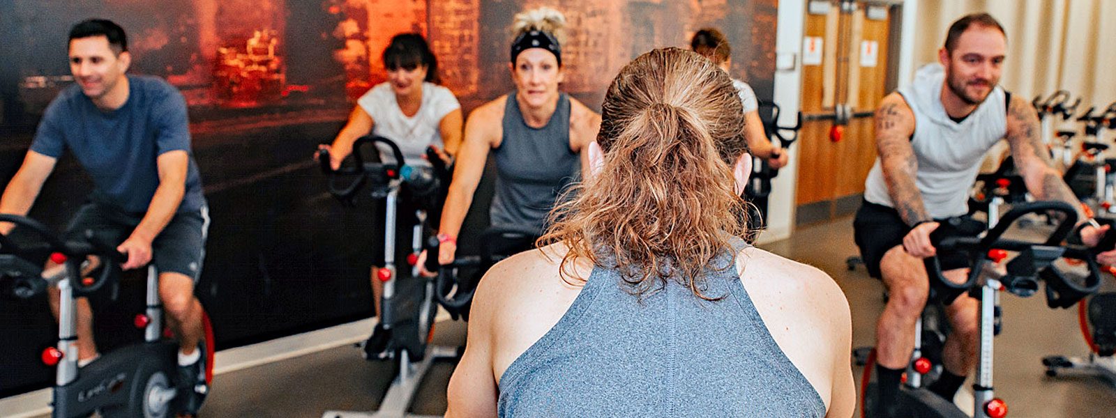 Spin class designed for corporate fitness in a corporate wellness program.