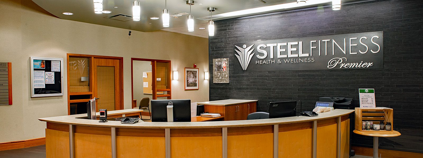 Front desk and lobby at Steel Fitness Premier.